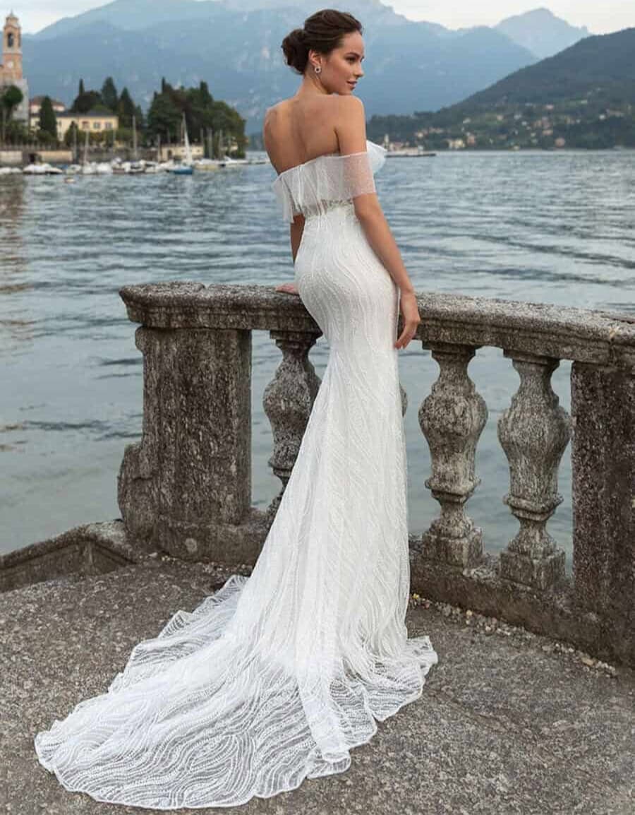 Magnetism dos Pollardi robe de mariée sirène dentelle top corset manches longues bouffantes traîne fourreau moulante sexy glamour magasin de robes de mariée Paris