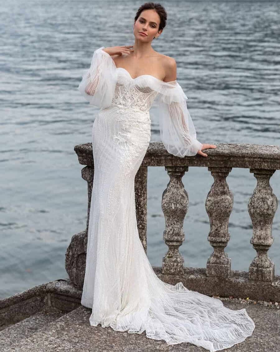 Magnetism face Pollardi robe de mariée sirène dentelle top corset manches longues bouffantes traîne fourreau moulante sexy glamour magasin de robes de mariée Paris