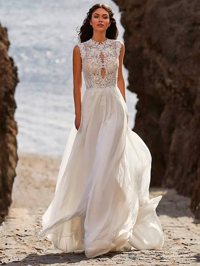 Bette face Pronovias robe de mariée fluide top guipure transparence jupe mousseline fluide évasée magasin de robes de mariée Nogent-sur-Marne