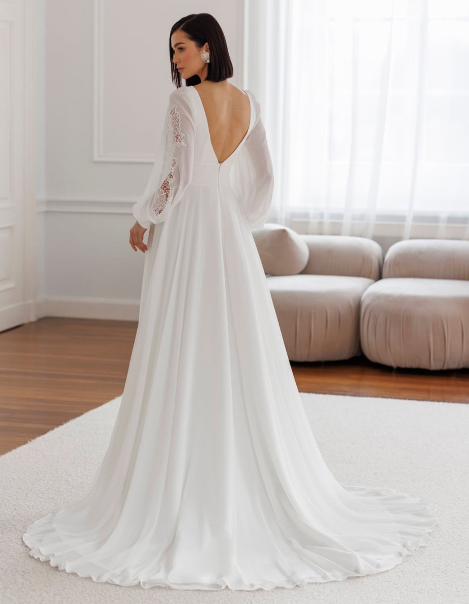 Vêtement de mariée élégante avec dos en V et manches en dentelle, parfait pour une robe de mariage sophistiquée. Conçue pour les mariées modernes recherchant un style chic et intemporel.