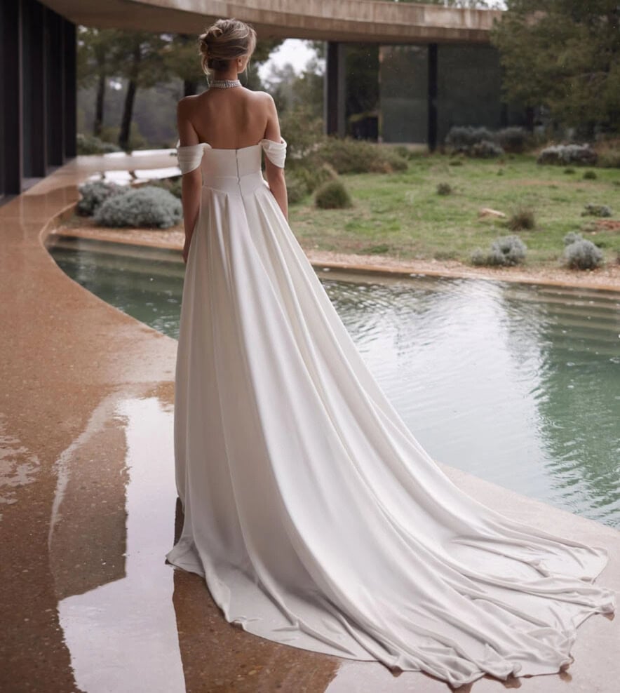 Palace dos Eva Lendel robe de mariée sirène fluide fourreau bustier drapé jupe fendue traîne manchettes drapée magasin de robes de mariée Paris