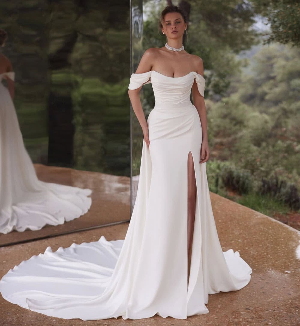 Palace face Eva Lendel robe de mariée sirène fluide fourreau bustier drapé jupe fendue traîne manchettes drapée magasin de robes de mariée Paris